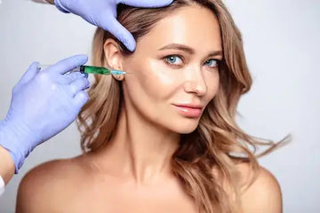 woman demonstrating cosmetic injection procedure