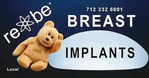 teddy bear leaning on a breast implant billboard ad