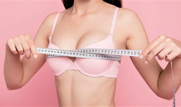 woman wearing bra measuring bust